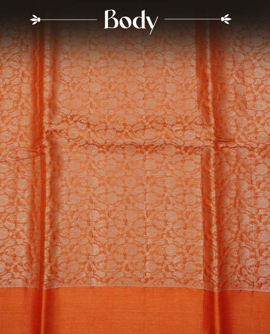 Burnt Orange  colour pure tussar silk saree featuring Light gold zari floral kodi work on the body, a plain border, grand pallu, Paired With  a matching blouse piece.