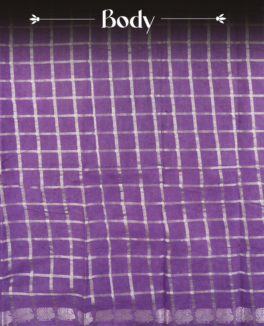 Purple colour Chettinad cotton saree featuring silver checked patterns on the body, accentuated with elegant silver peacock motifs along the border & Comes with a matching blouse piece.