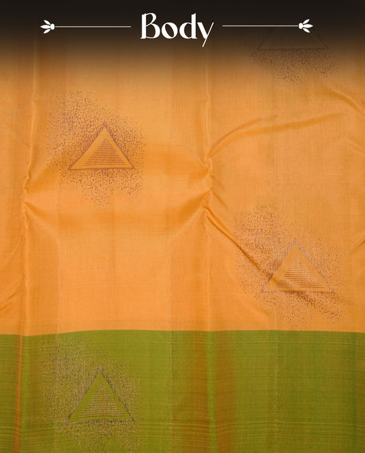 Mustard Colour Traditional Kancheepuram Silk Saree Featuring Bronze Zari Triangle Motifs on the Body, Designed With a Green Border and with a Grand Pallu, Paired with a Matching Blouse.