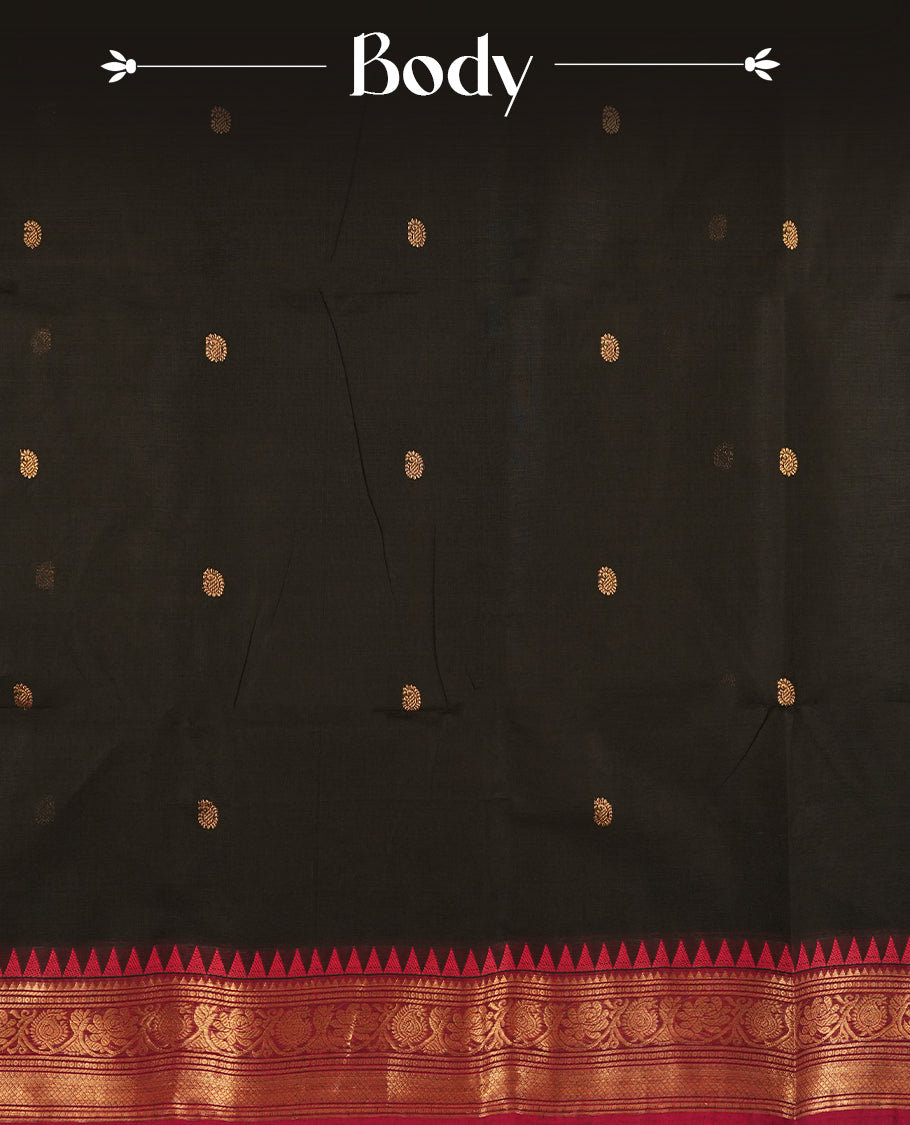Black colour Chettinad cotton saree adorned with small woven motifs on the body, highlighted by a maroon border featuring intricate golden zari floral patterns and temple design & Comes with a matching blouse piece.
