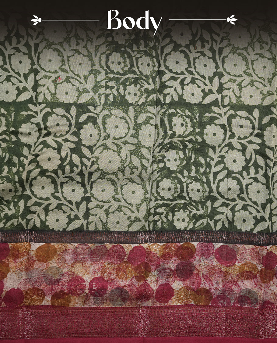 Dark green colour chanderi silk saree featuring floral kodi print pattern across body, with contrast red colour border with zari pattern and paired with matching blouse.