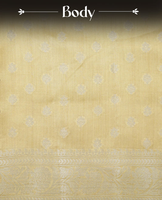 pastel yellow Colour Tussar silk saree with silver zari buttas On Body, a Contrast  Self Coloured zari border and pallu, Paired With a matching blouse piece.