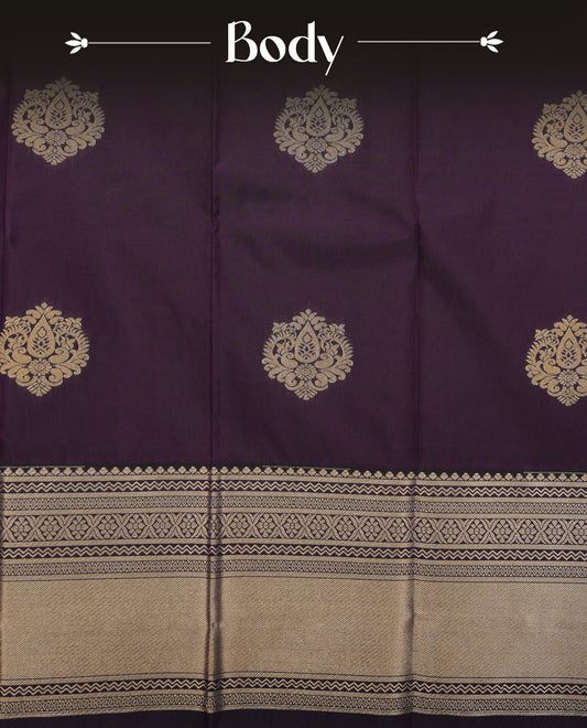 Deep purple colour soft silk saree featuring gold zari floral motifs on body, contrast self colour gold zari traditional border, grand pallu comes with matching blouse piece.