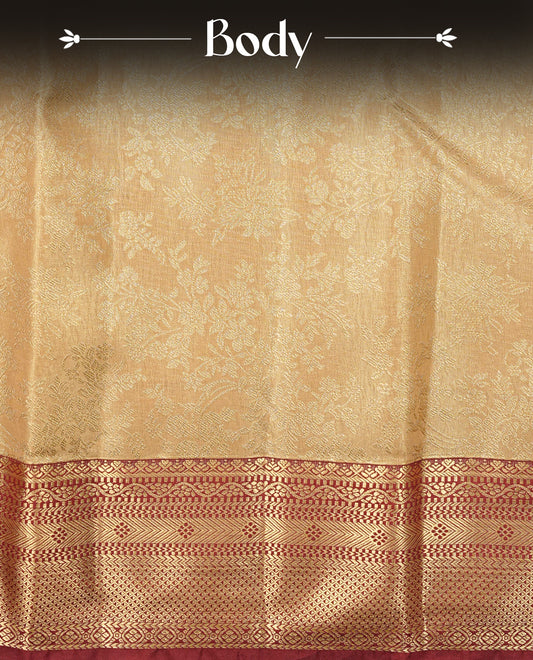 Light Gold colour Semi Tissue Silk Saree featuring gold zari Works on the body, complemented by an intricately woven gold zari pallu, a rich Maroon border with gold zari work and paired with a matching plain blouse piece.