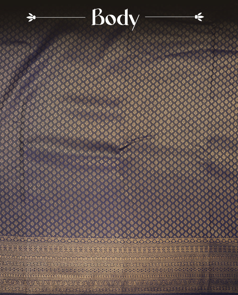 Navy blue colour semi soft silk saree featuring gold zari motifs on across body, self colour border with traditional gold zari pattern, pallu and paired with matching blouse.