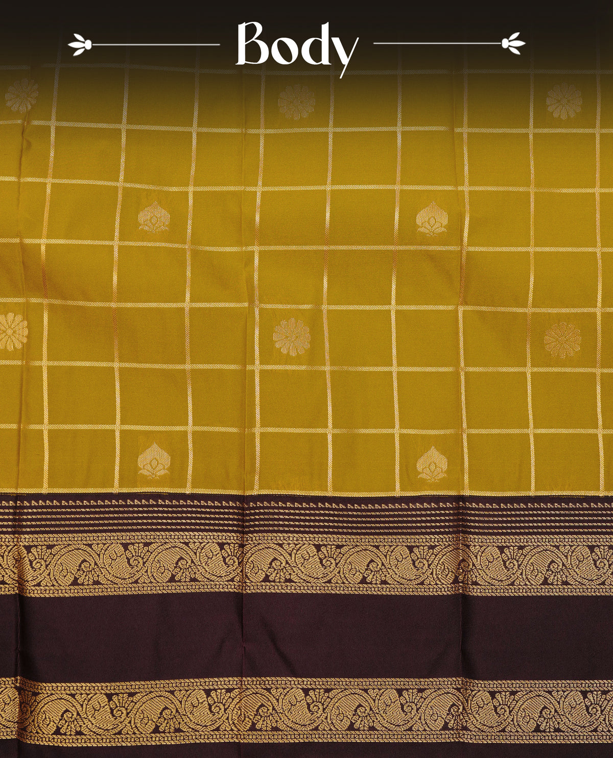 Dark mustard colour soft silk saree featuring floral gold zari checks with florals on body, contrast dark brown colour traditional border, grand pallu comes with matching blouse piece.