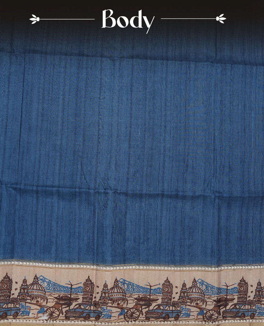 Blue colour semi tusser silk saree featuring contrast cream colour London bridge printed pattern border and paired with matching blouse.