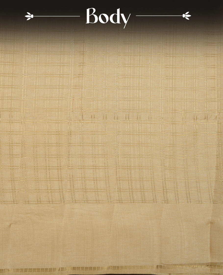 Cream colour semi Tussar saree highlights gold zari check pattern across body,  border, pallu and paired with matching blouse piece.
