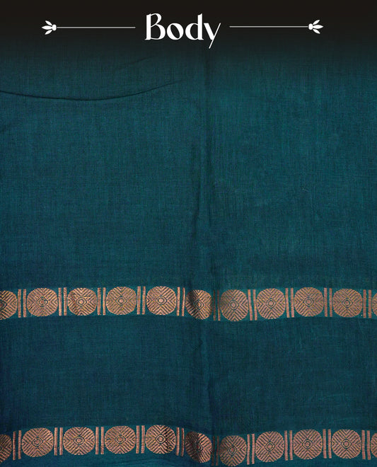 Teal Green  Colour Sungudi Cotton Saree with gold zari coin motifs on the body, a matching gold zari border, and a striped gold zari pallu. Paired with a contrast maroon blouse featuring a gold zari border.