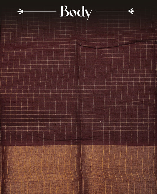 Brown Sungudi cotton saree featuring elegant gold zari checks across the body, complemented by a contrast gold zari border. Comes with a matching blouse piece.