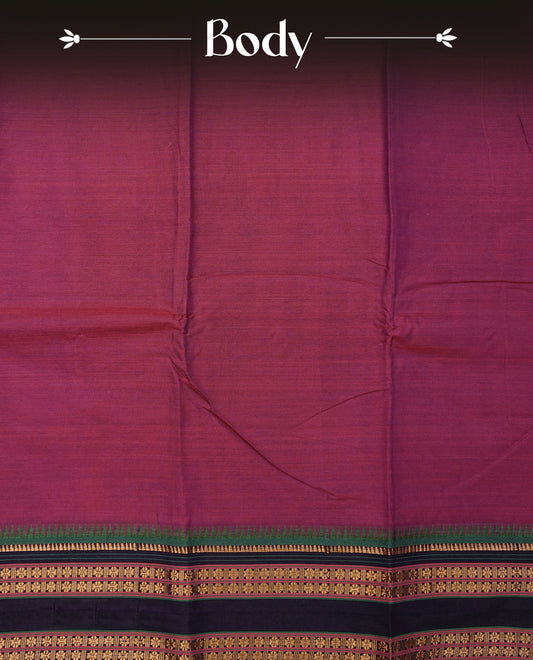 Dark magenta colour Narayanapattu cotton saree with a plain body, complemented by a green colour with gold zari border & contrast pallu, paired with a matching blouse piece.