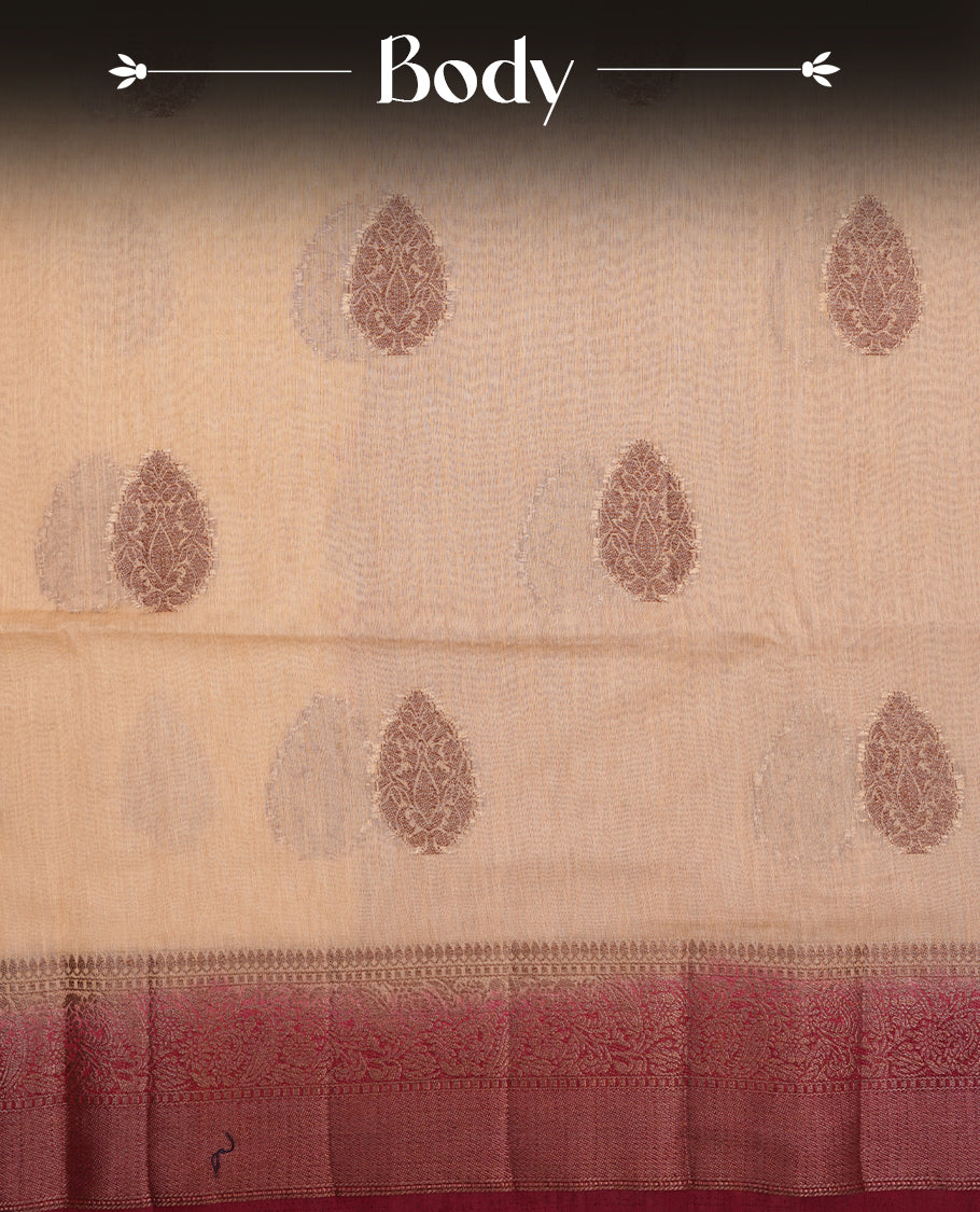 Cream colour semi linen silk saree featuring antique zari motifs on body, traditional border with contrast Deep red colour, pallu and paired with matching blouse