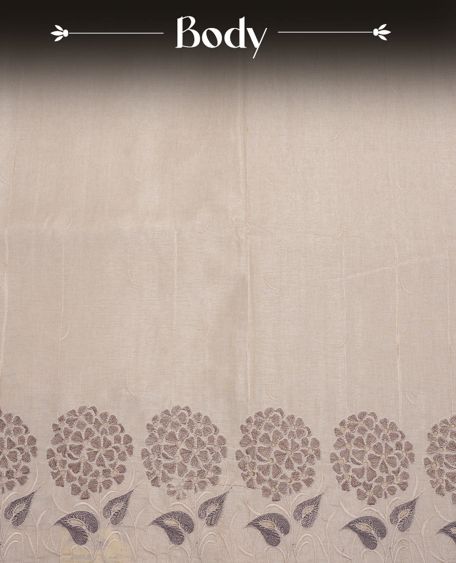 Beige colour Tussar silk saree featuring Elegant plain body, highlighting Grey colour floral cut work with Light gold zari border, pallu and paired with matching blouse piece.