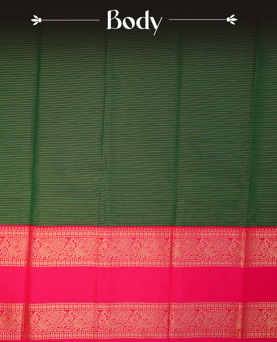 Dark Green coloured soft silk saree featuring gold zari stripes and motifs across the body, enhanced with a contrast Magenta border and pallu, paired with a matching contrast blouse piece