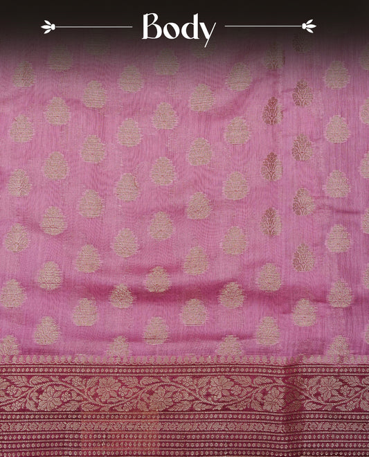 Onion Pink colour Tussar Silk saree featuring antique zari butta motifs on the body, complemented by a contrasting maroon floral zari border and pallu, paired with a matching blouse piece.
