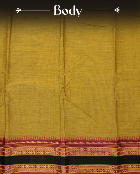 Olive Yellow colour Narayanapattu cotton saree with a plain body, complemented by a maroon colour with gold zari border & contrast pallu, paired with a matching blouse piece.