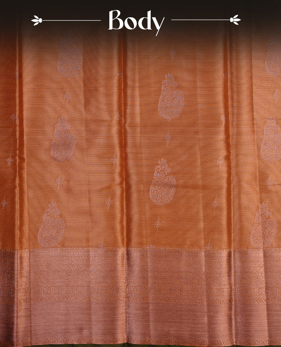 Rose gold colour semi tissue silk saree featuring gold zari motifs on body, self colour with copper zari traditional green simple border, paired with matching blouse piece.