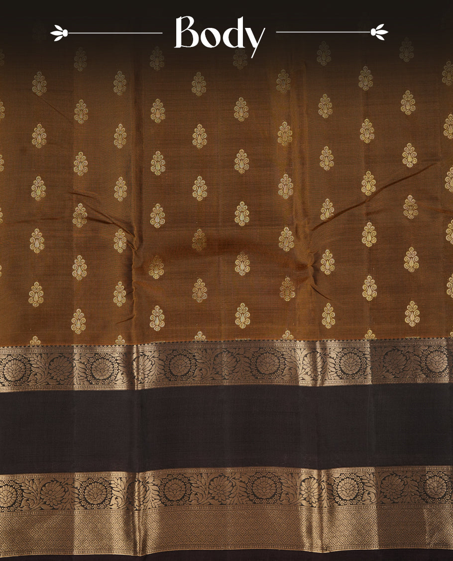 Khaki colour soft silk saree featuring gold zari motifs on the body, complemented by a contrast chocolate traditional zari border and pallu, paired with matching blouse piece.