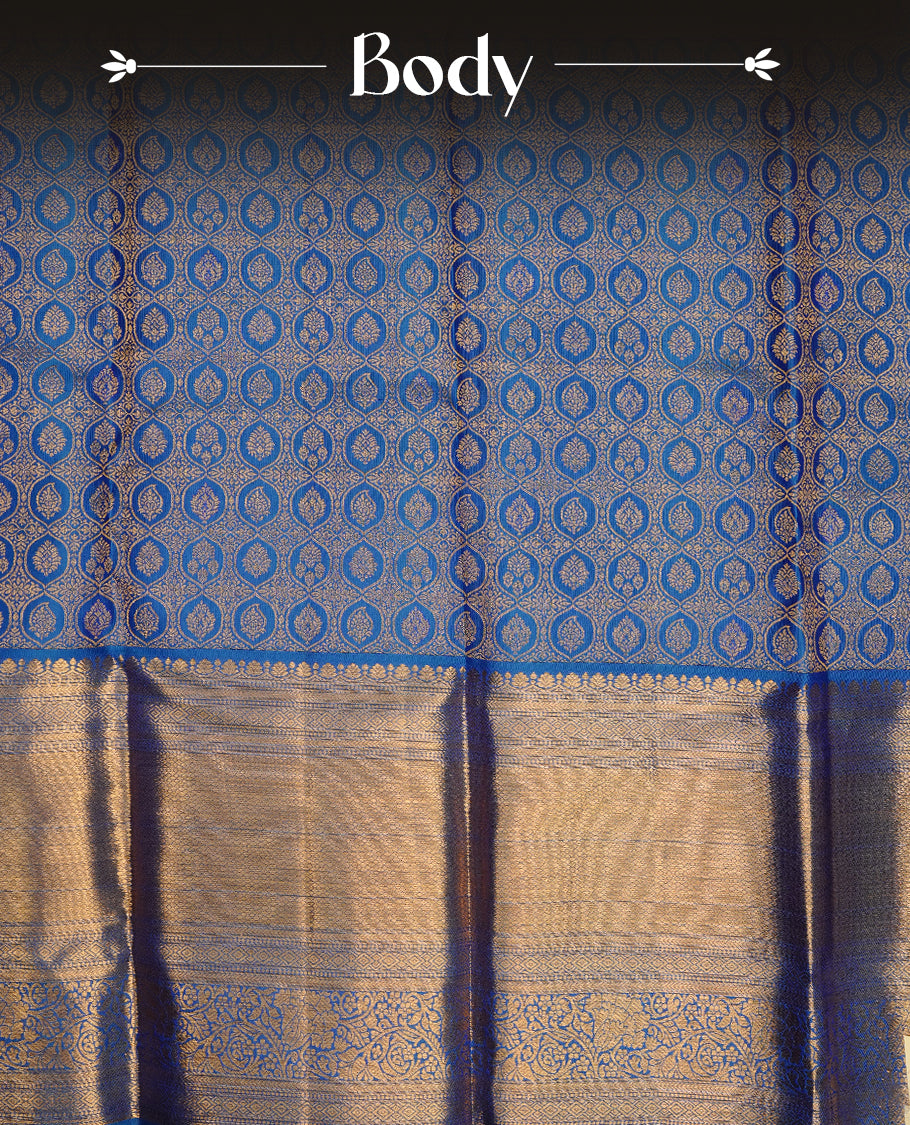 Blue colour kancheepuram silk saree featuring gold zari pattern across body, complemented by selfcolour border traditional zari border, paired with matching blouse piece.