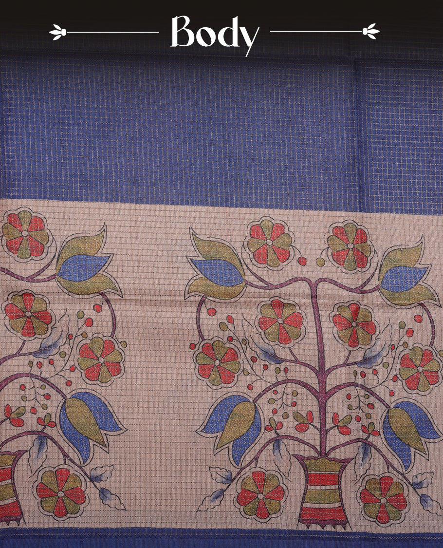 Wheat colour semi tussar silk saree featuring floral print and check pattern across body, contrast blue colour border and pallu, paired with matching blouse piece.