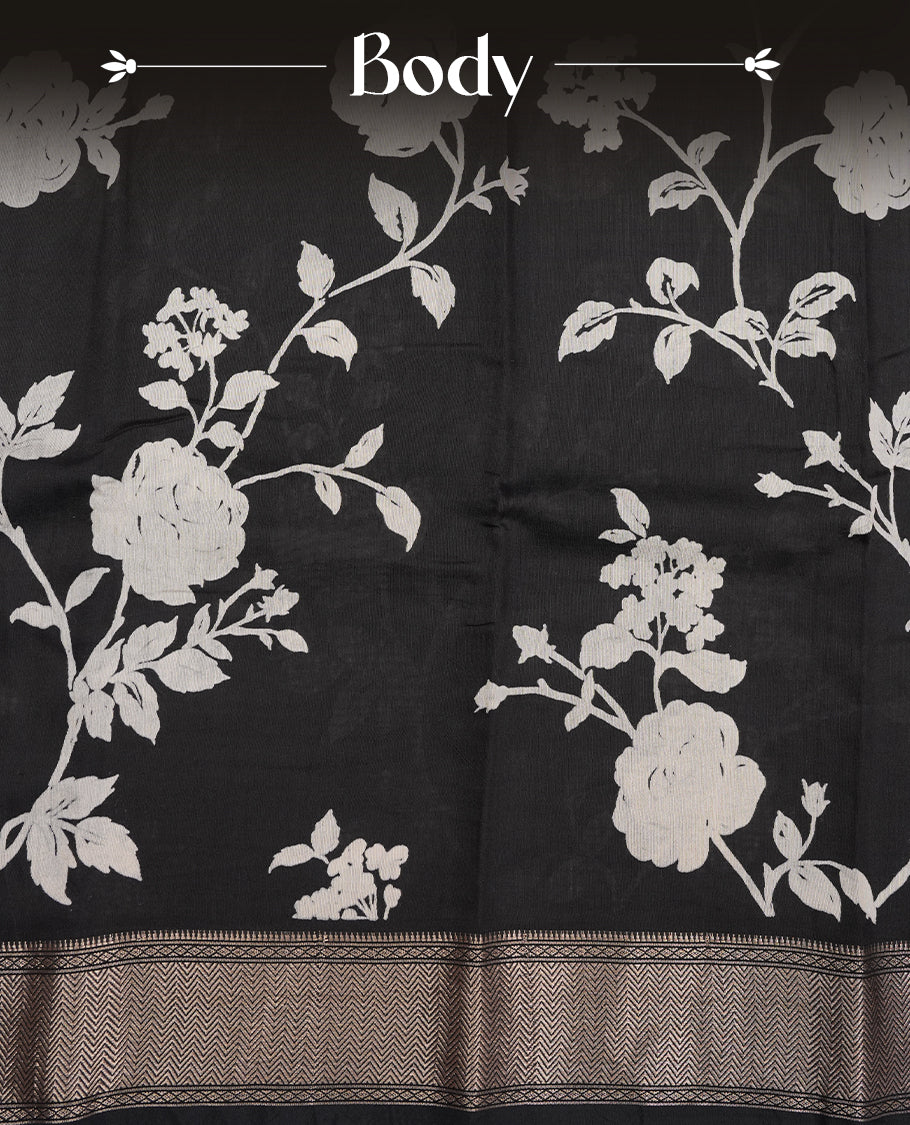 Black colour Viscos semi printed saree featuring a light golden zari border, abstract off white printed motifs on the body, and comes with a matching blouse