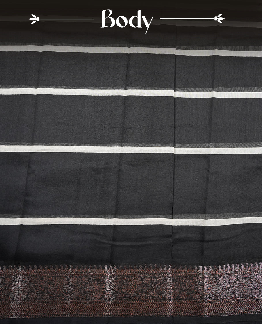 Black colour chanderi silk saree featuring white stripped print pattern across body, with Antique zari pattern border and paired with matching blouse.