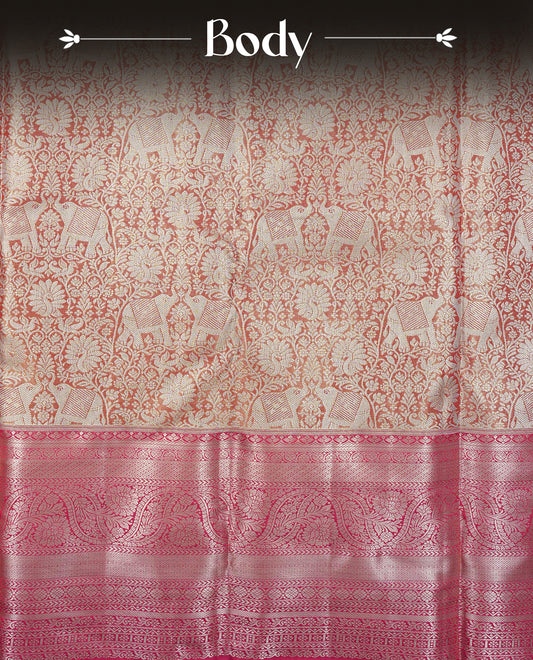 Orange Colour Tissue Silk Saree featuring elephant, peacock, and floral light gold zari woven motifs across the body, a richly woven zari pallu, complemented by a contrast pink border with light gold zari & paired with a matching blouse piece.