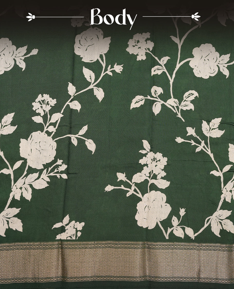 Green colour Viscos semi printed saree featuring a light golden zari border, abstract off white printed motifs on the body, and comes with a matching blouse