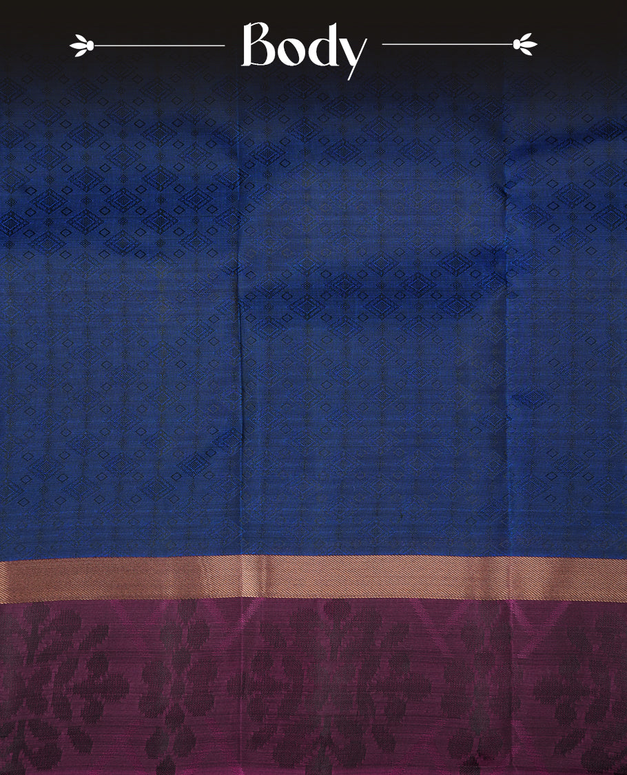 Blue colour soft silk saree featuring gold zari motifs on the body, complemented by a contrast Magenta zari floral kodi border and pallu, paired with a matching blouse piece.