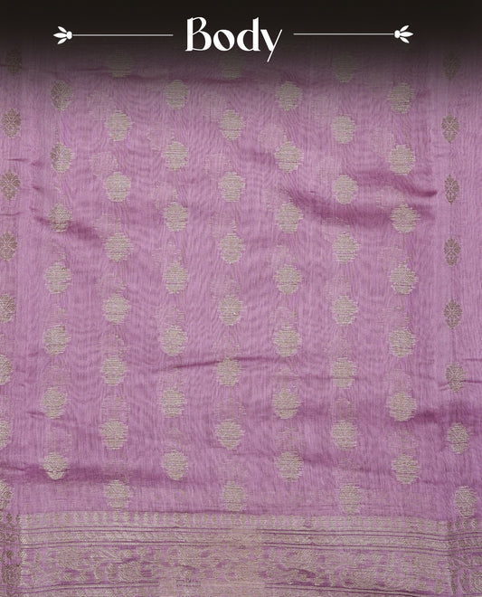 mauve  colour Tussar Silk saree featuring antique zari butta motifs on the body, enhanced with a self-coloured floral Gold zari border and  pallu, paired with a matching blouse piece.