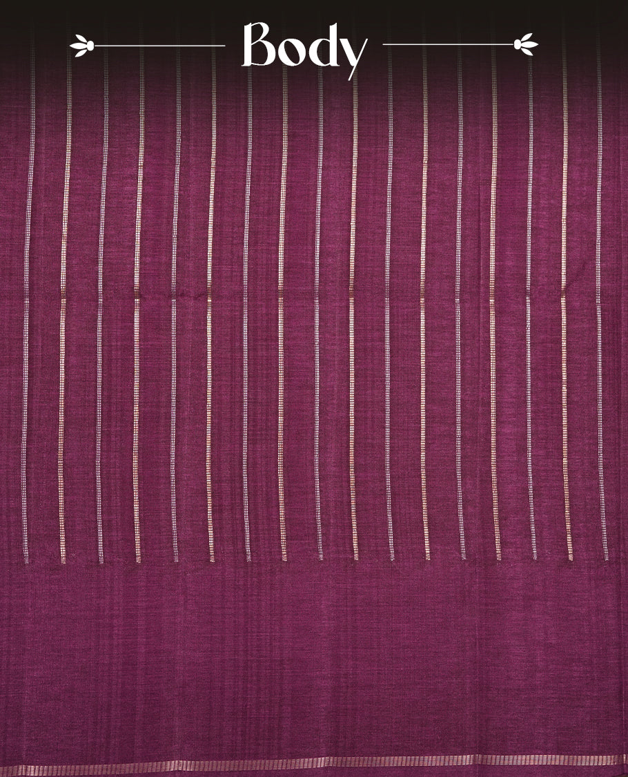 Purple colour semi tussar silk saree highlights gold and silver zari stripes across body,  border, pallu and paired with matching blouse piece.