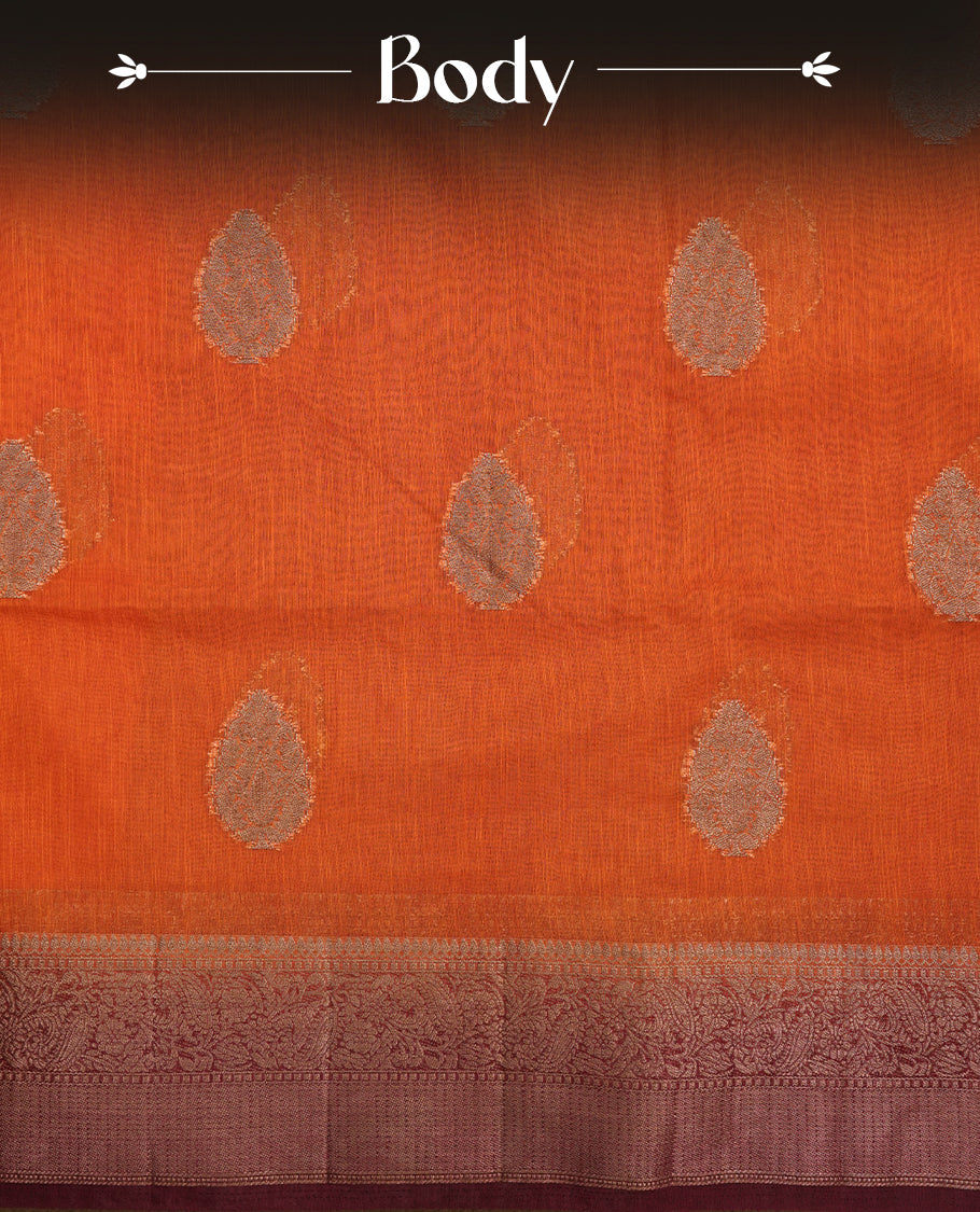Burnt orange colour semi linen silk saree featuring antique zari motifs on body, traditional border with contrast maroon colour, pallu and paired with matching blouse