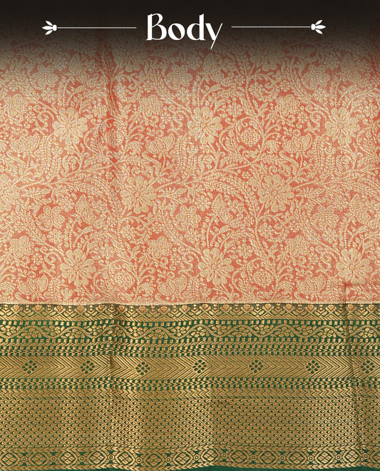 Red colour Semi Tissue Silk Saree featuring gold zari floral kodi Works on the body, complemented by an intricately woven gold zari pallu, a rich Green border with gold zari work and paired with a matching plain blouse piece.