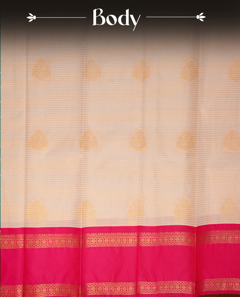 Cream coloured soft silk saree featuring gold zari stripes and motifs across the body, enhanced with a contrast Magenta  border and pallu, paired with a matching contrast blouse piece.
