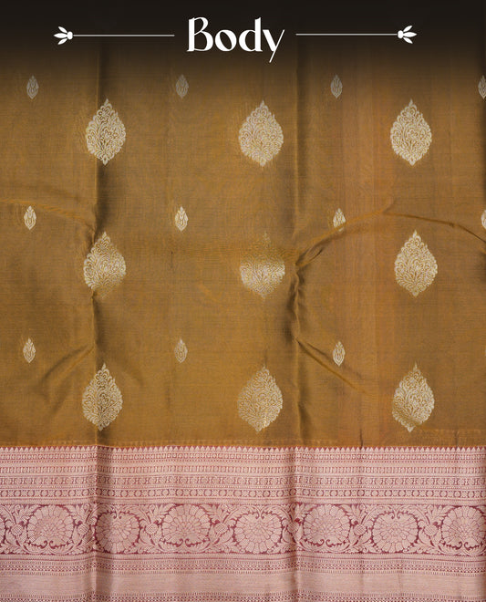 Mustard Olive Colour Traditional Kancheepuram Silk Saree with Elegant Gold Zari Buttas on the Body, Enhanced with a Contrast Maroon Colour  with Gold Zari Floral Border and Pallu, Paired with a Matching Blouse Piece.