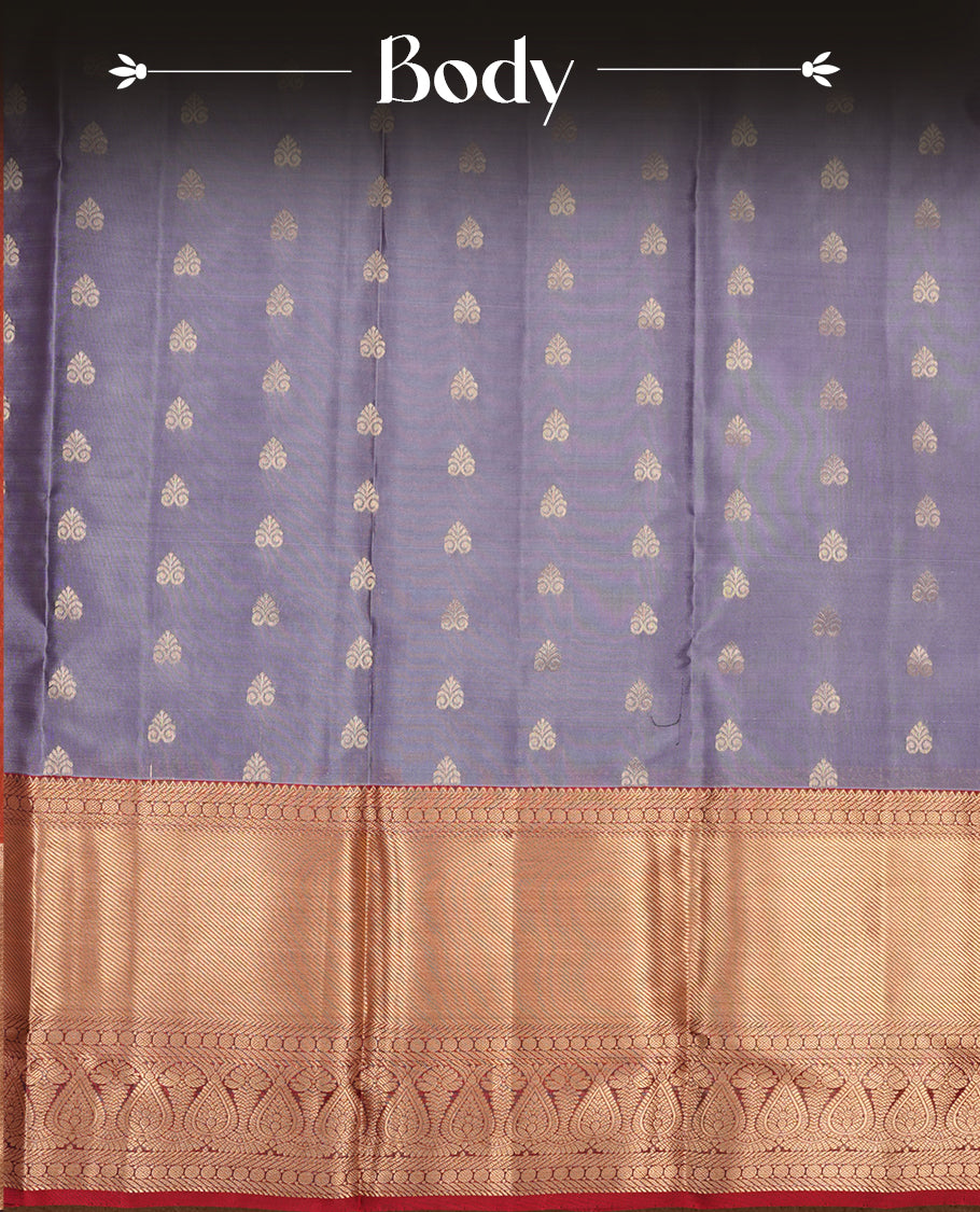 Lavender colour soft silk saree featuring gold zari motifs on the body, complemented by a contrast Red traditional zari border and pallu, paired with a matching blouse piece.
