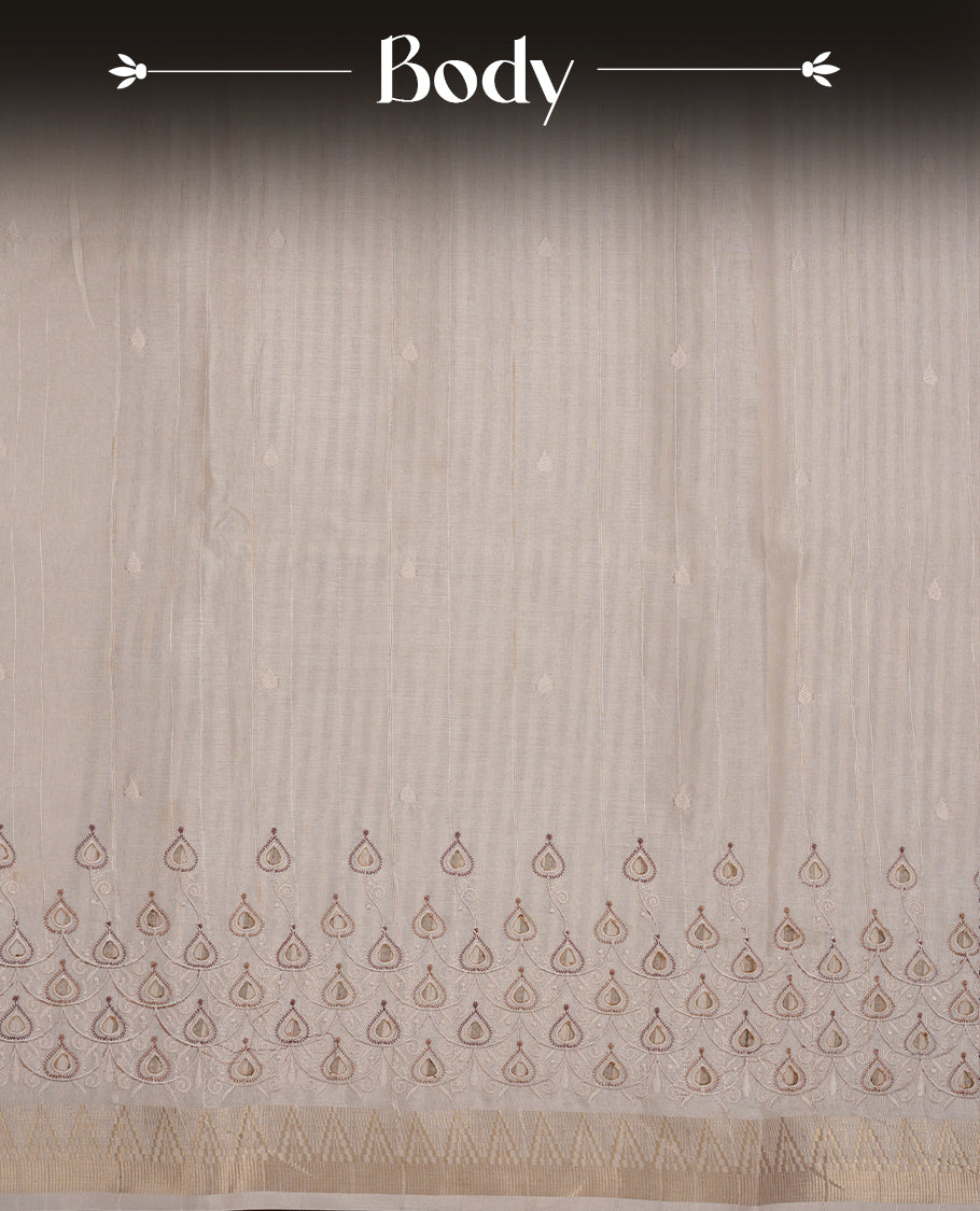 Beige colour Tussar silk saree featuring Elegant plain body, highlighting Brown colour cut work with Light gold zari border, pallu and paired with matching blouse piece.
