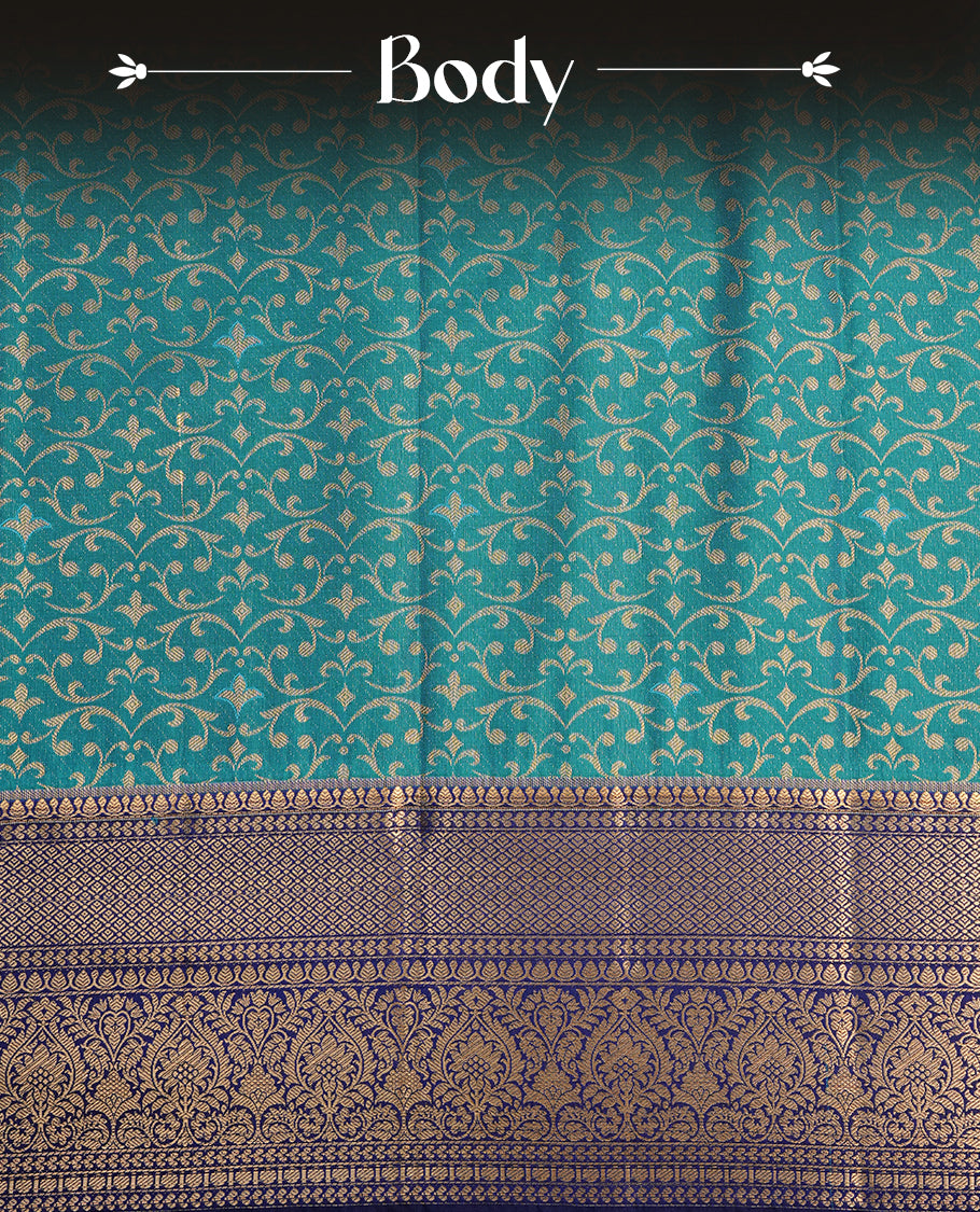Aqua colour semi wedding saree featuring gold zari pattern on body, complemented by contrast Blue with traditional border, paired with matching blouse piece.