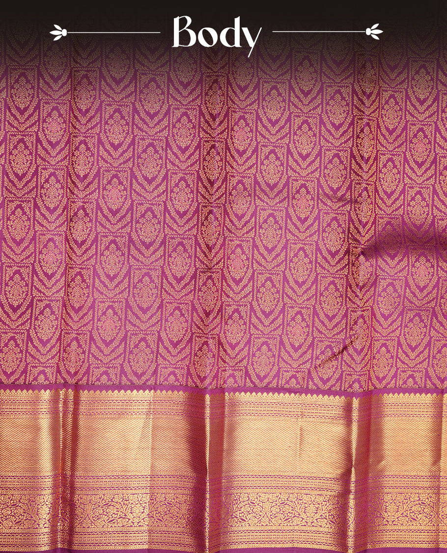 Purple colour kancheepuram silk saree featuring gold zari pattern across body, complemented by selfcolour border traditional zari border, paired with matching blouse piece.
