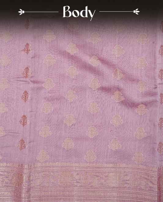 Onion Pink colour Tussar Silk saree featuring antique zari butta motifs on Body , enhanced with a self coloured floral Gold zari border and pallu, paired with a matching blouse piece.