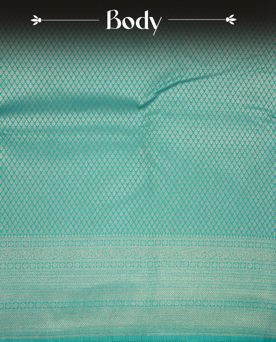 Aqua blue colour semi soft silk saree featuring gold zari motifs on across body, self colour border with traditional gold zari pattern, pallu and paired with matching blouse.