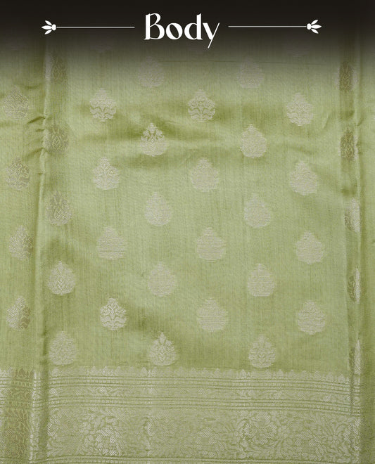 Pastel Gren Colour Tussar silk saree with silver zari buttas On Body, a Contrast  Self Coloured zari border and pallu, Paired With a matching blouse piece.