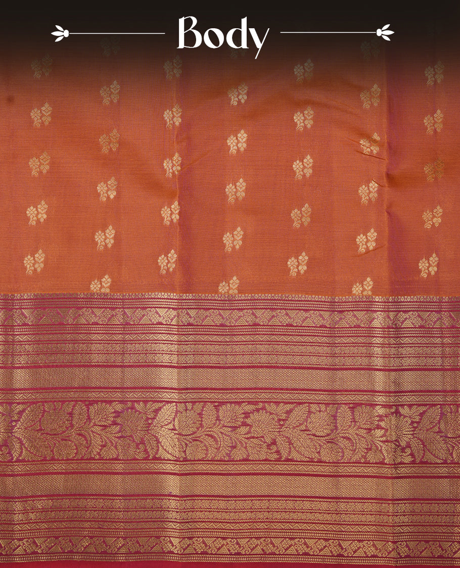 Rust orange colour soft silk saree featuring gold zari motifs on the body, complemented by a contrast Red traditional zari floral kodi border and pallu, paired with a matching blouse piece.