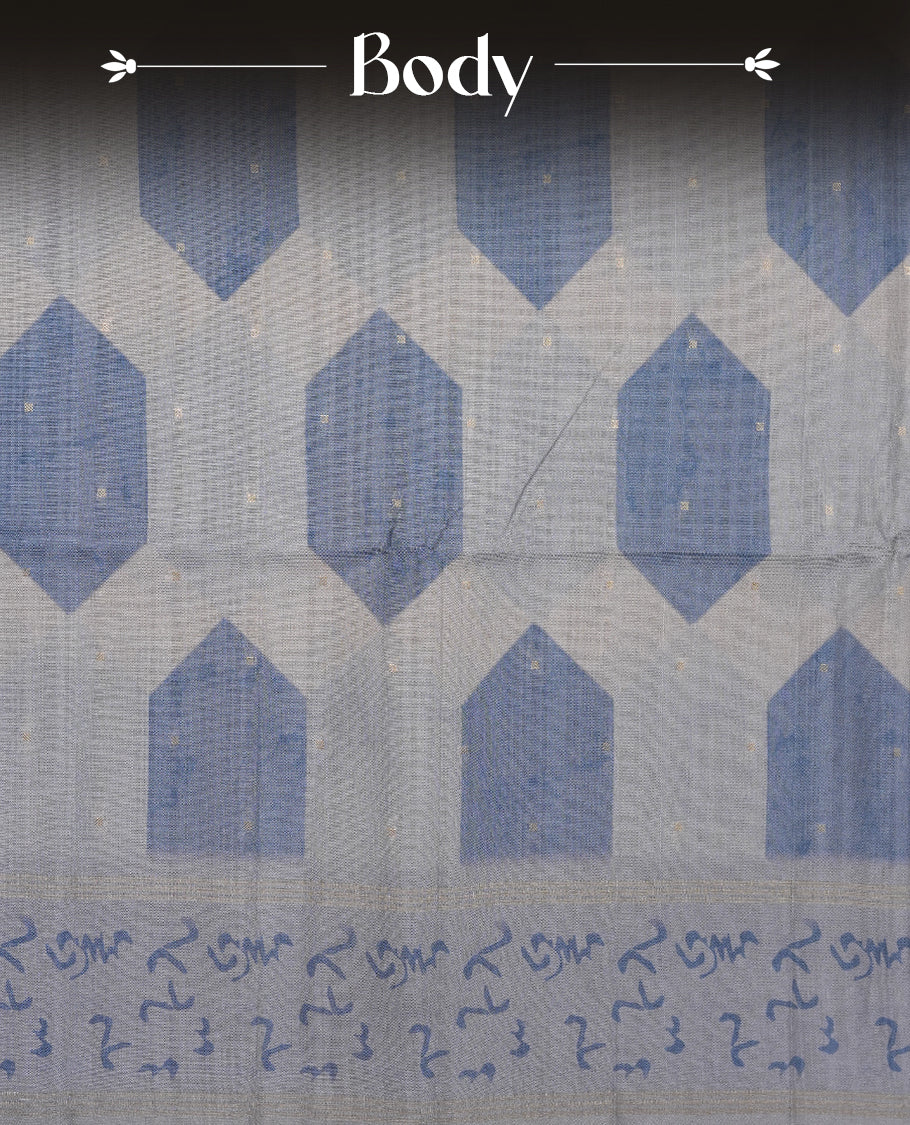 Steel blue colour semi tusser silk saree featuring geometric print pattern across body, gold zari border with style motifs and paired with matching blouse.