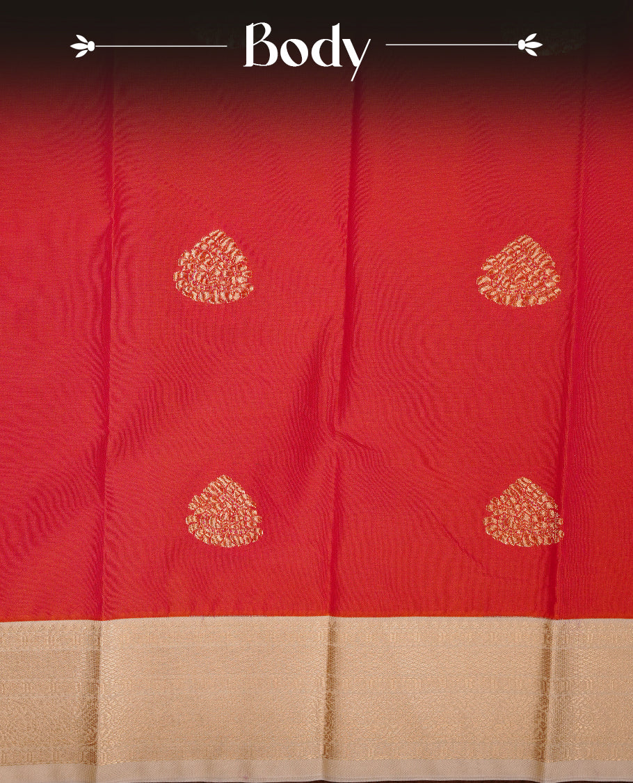 Red coloured soft silk saree featuring gold zari motifs across the body, enhanced with a contrast Cream border and pallu, paired with a matching contrast blouse piece