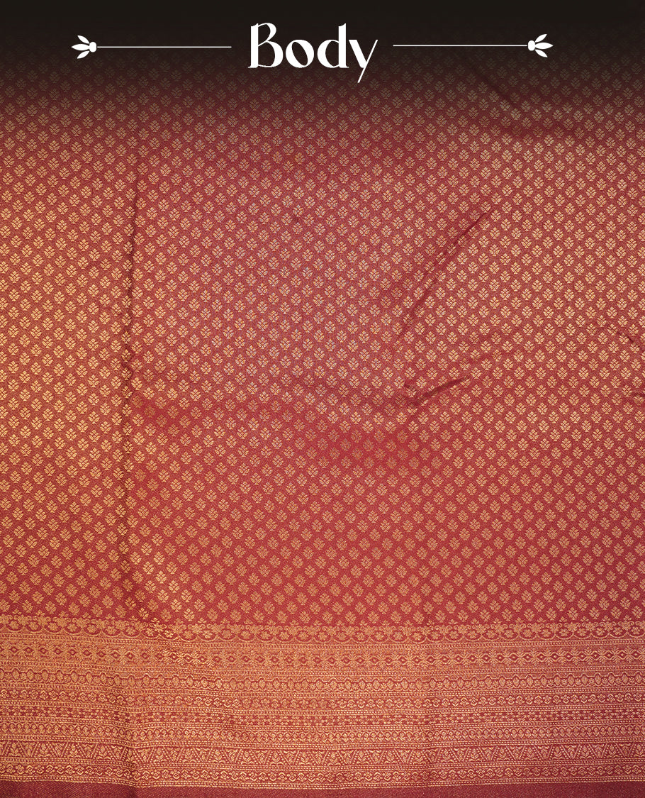 Maroon colour semi soft silk saree featuring gold zari motifs on across body, self colour border with traditional gold zari pattern, pallu and paired with matching blouse.