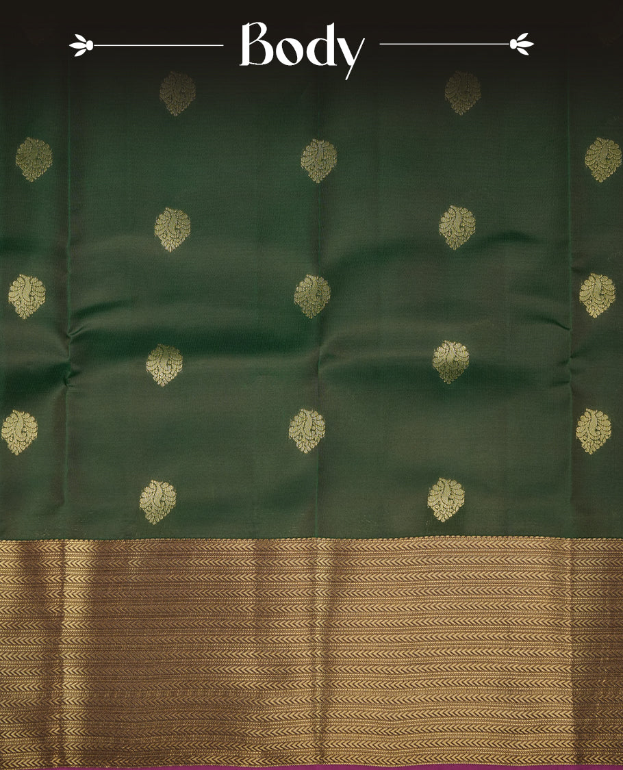Green colour soft silk saree featuring gold zari motifs on the body, complemented by a contrast Magenta traditional zari floral kodi border and pallu, paired with a matching blouse piece.