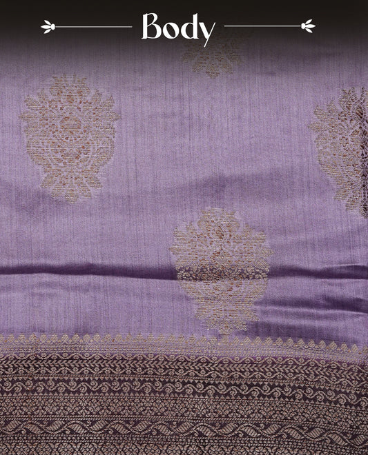 Lavender Colour Tussar Silk saree with elegant antique zari floral motifs On Body, a contrasting Wine zari border, a rich zari pallu, Paired With a matching  blouse piece.