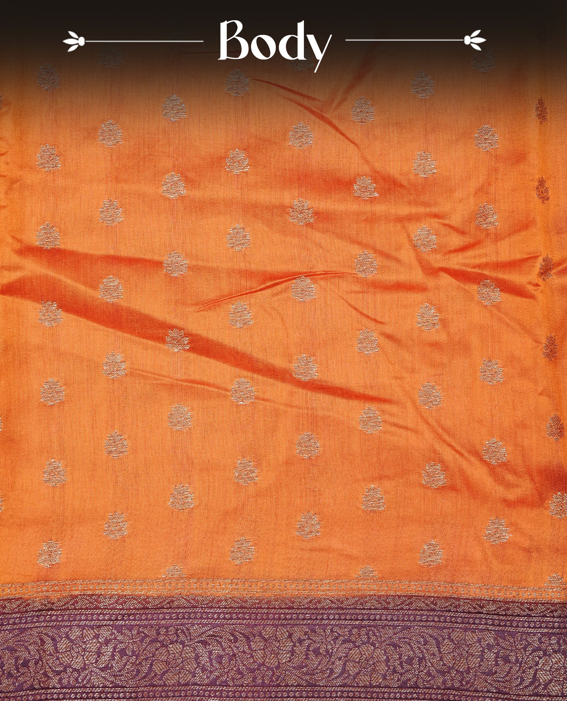 Radiant orange Colour Tussar silk saree with antique zari buttas On Body, a rich Wine floral zari border, an elegant floral zari pallu, Paired With a matching blouse piece.