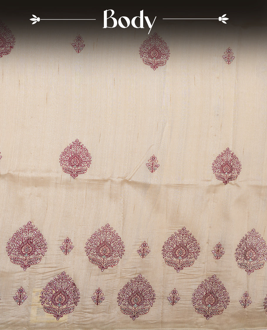 Cream colour semi tusser silk saree featuring Floral thread embroidery across body, without border and paired with matching blouse.